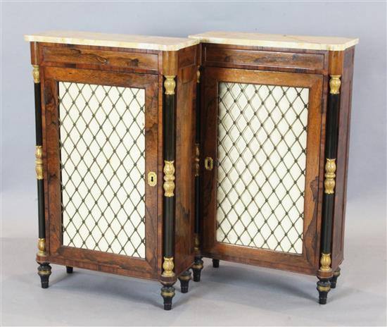 A pair of Regency style rosewood pier cabinets, W.1ft 9.5in. D. 9in. H.2ft 11in.